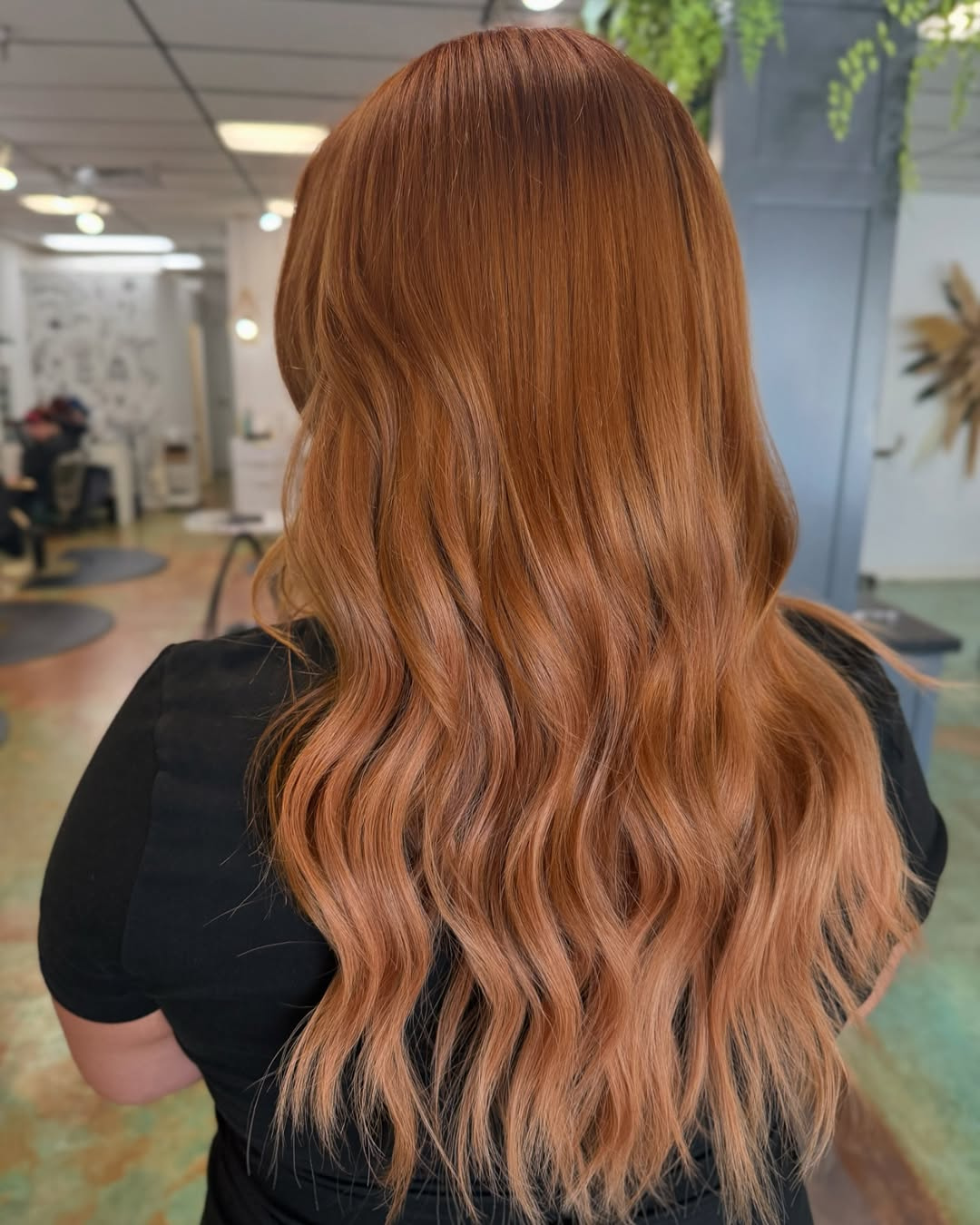 16-inch Bellami ginger hair extensions with soft waves styled by Ashley in New Orleans, Louisiana.